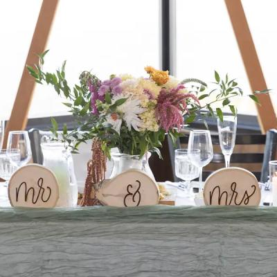 Wedding table setup featuring floral centerpiece and 