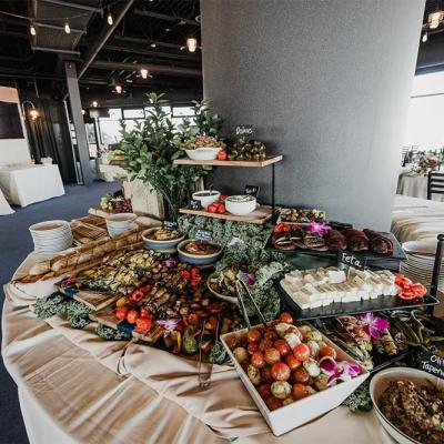 A vibrant display of gourmet appetizers, including cheeses, olives, and vegetables.