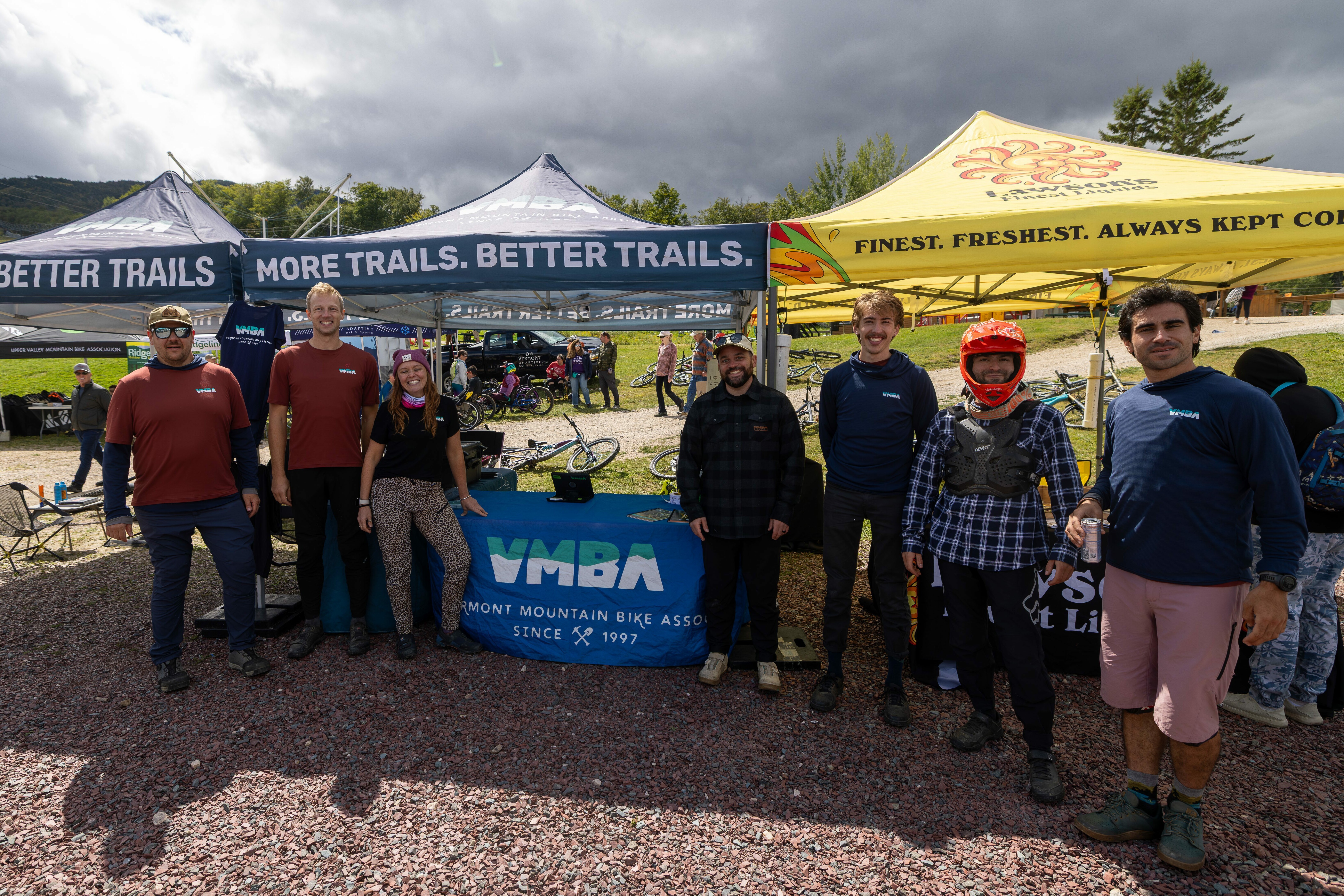 Group of people at a bike event, promoting the Vermont Mountain Bike Association.