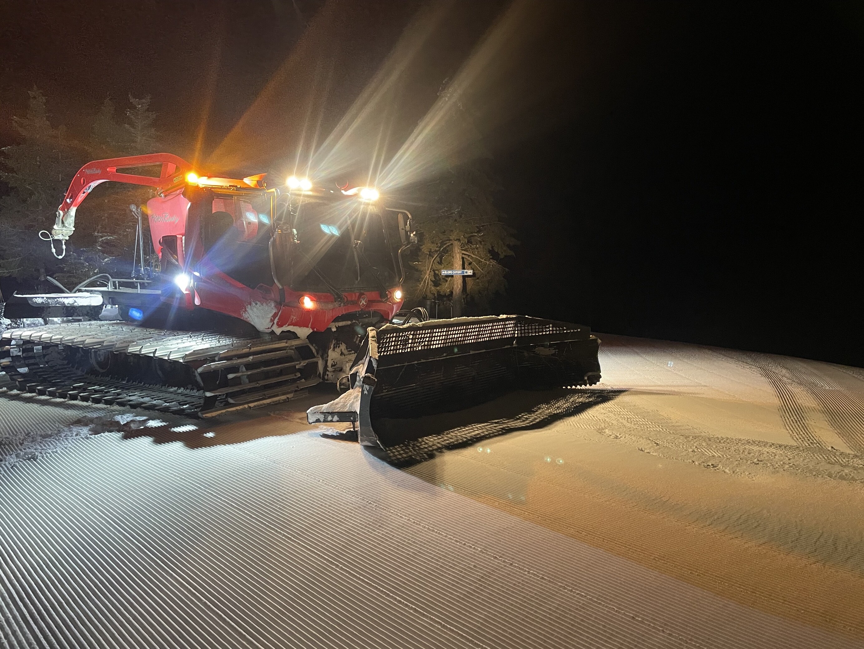 Photo of a grooming tractor at night