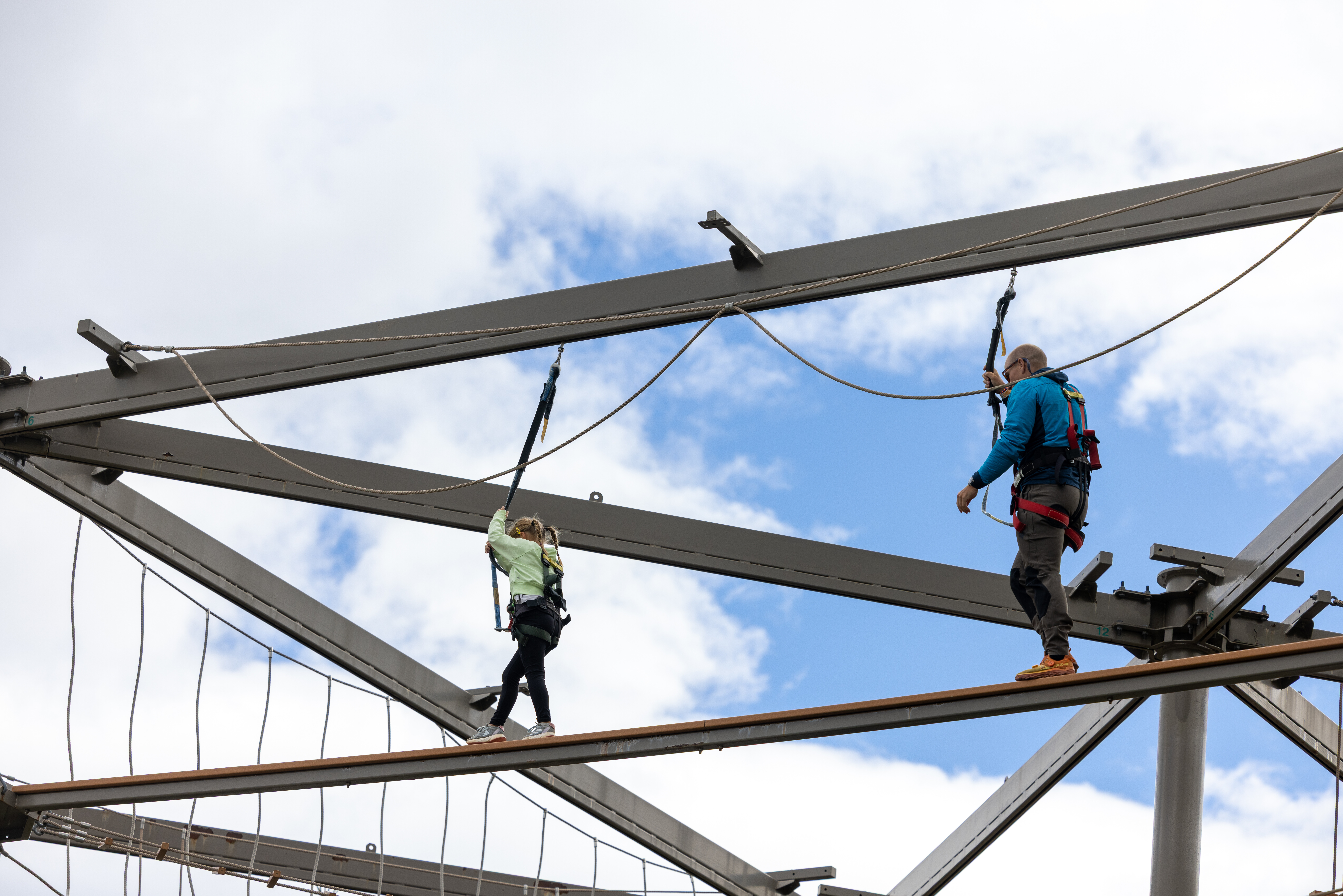 A parent and child on the Skye Ropes Course at Killington Resort's Adventure Center