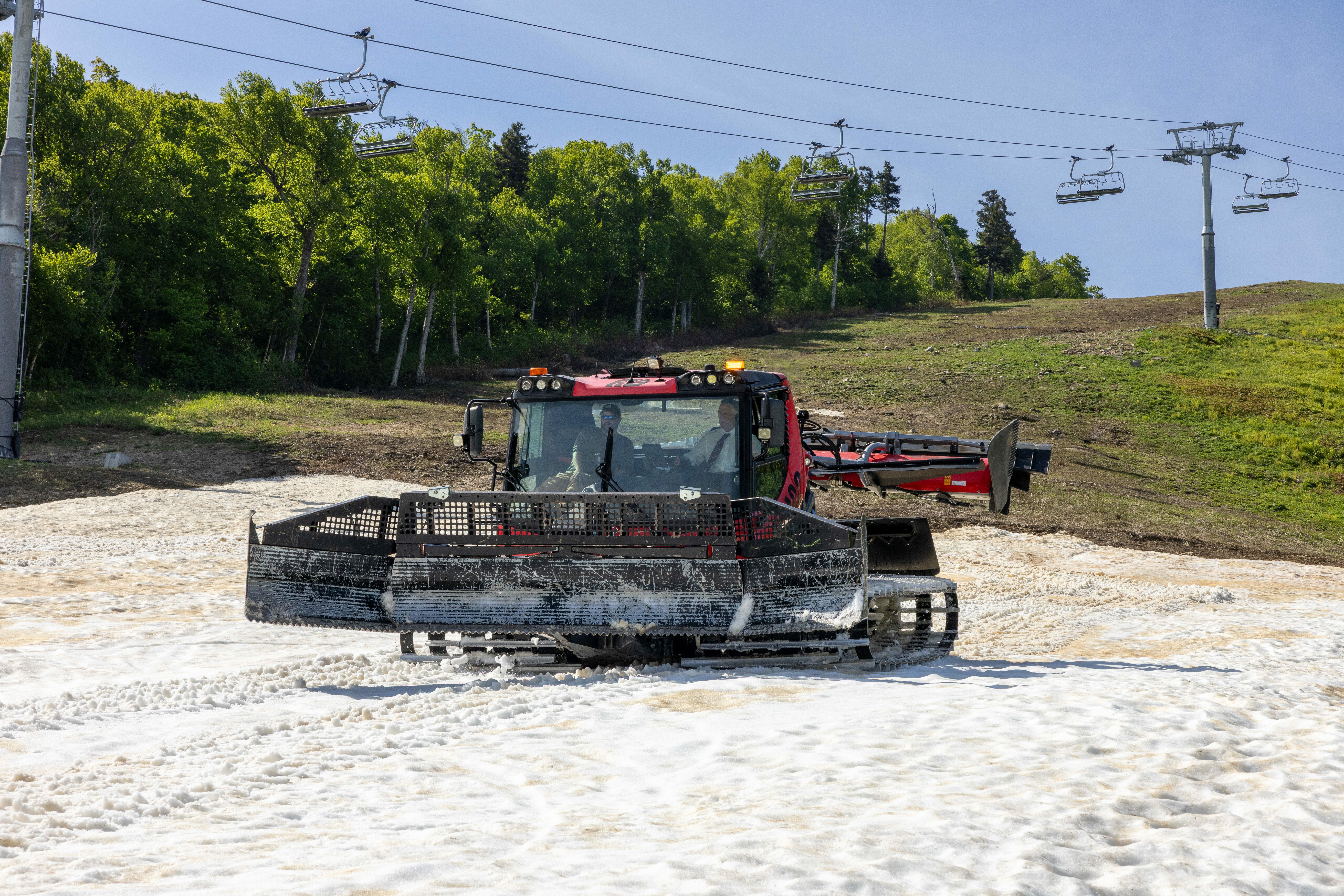Governor Phil Scott operates a grooming tractor at Killington Resort