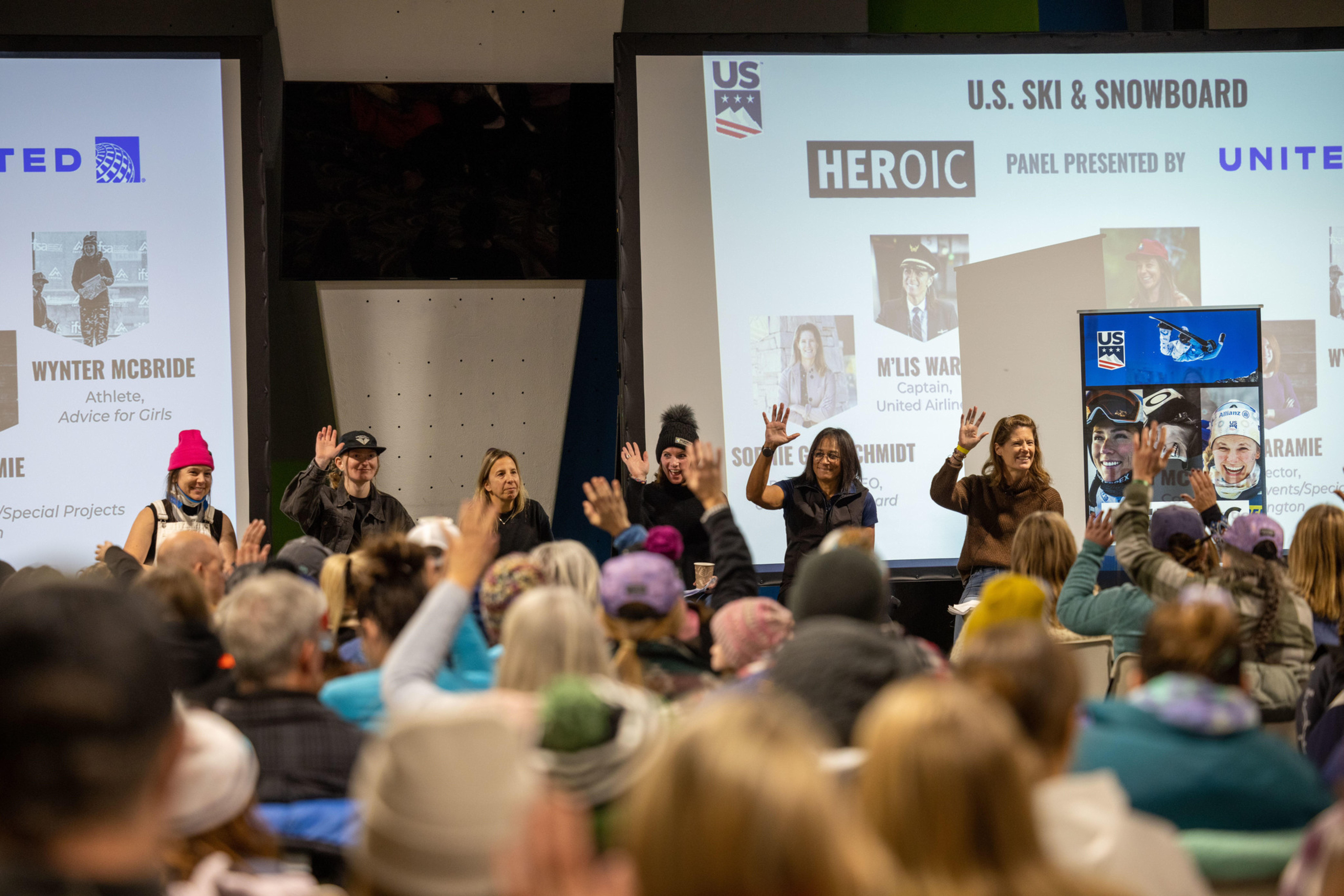 Panel discussion featuring women athletes at a U.S. Ski & Snowboard event. Audience engaged.