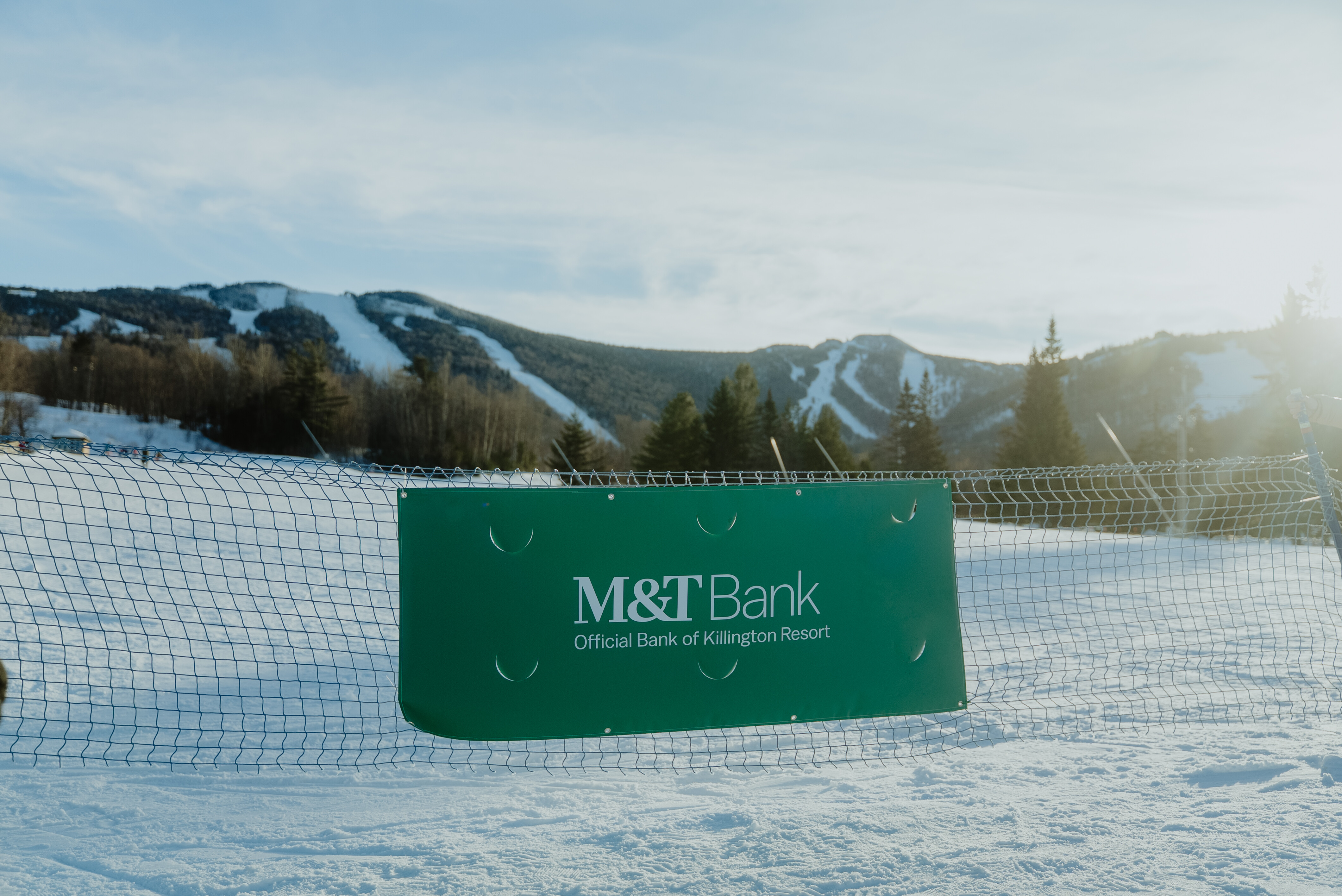 Banner for M&T Bank at Killington Resort with snowy mountains in the background.