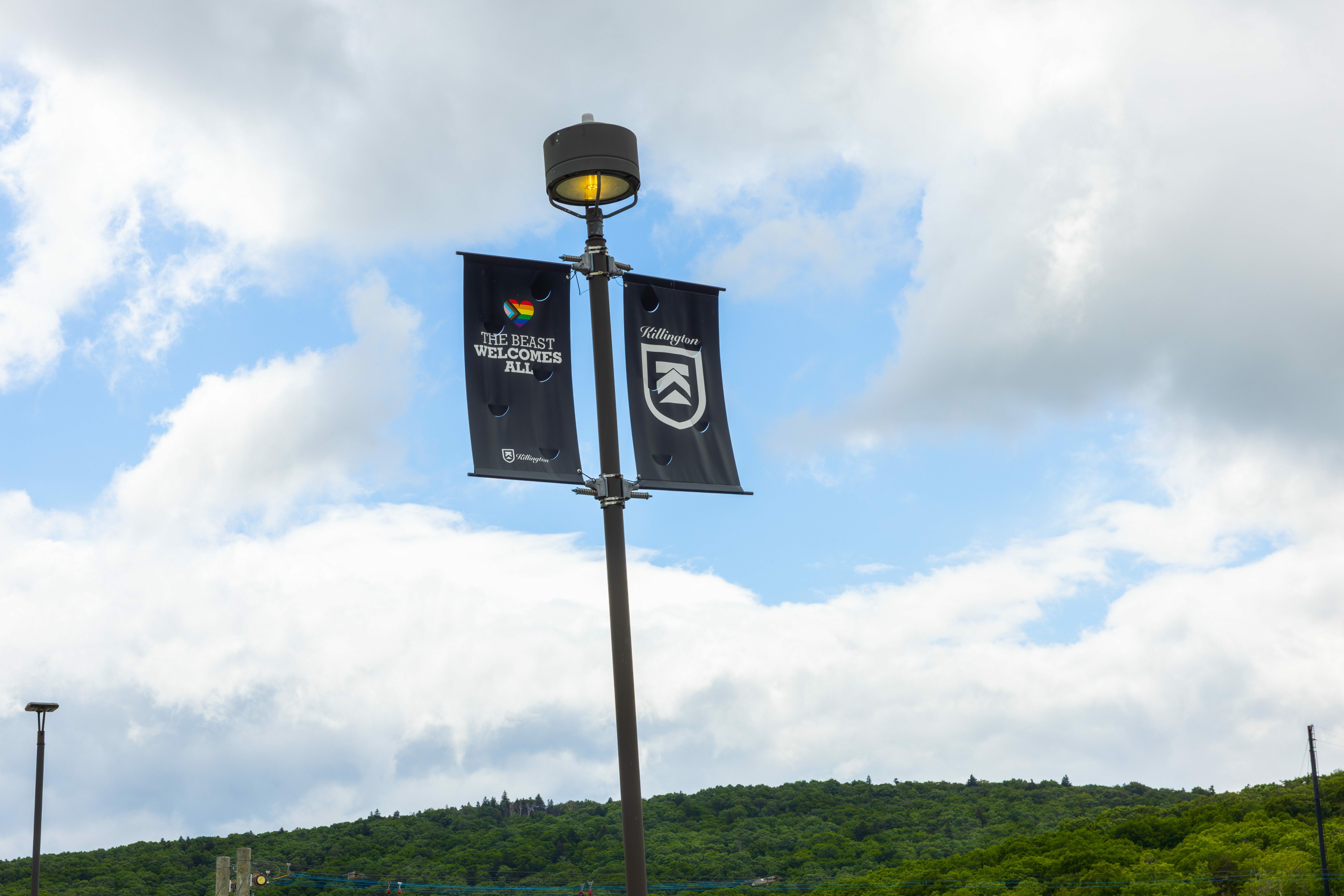 Banner that reads "The Beast welcomes all" at Snowshed parking lot