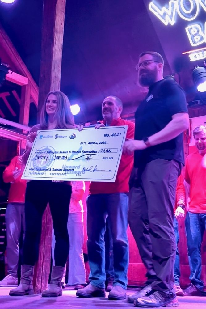Photo of donation check from Wobbly Barn line dancing fundraiser