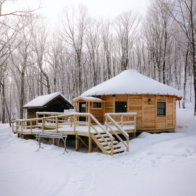 The exterior of the Ledgewood Yurt in the snow